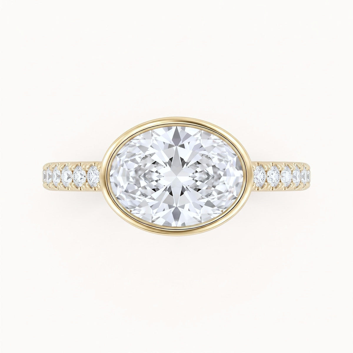 East-West Oval Bezel Engagement Ring with Pavé Band in Gold