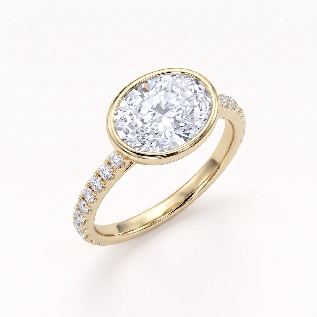 East-West Oval Bezel Engagement Ring with Pavé Band in Gold