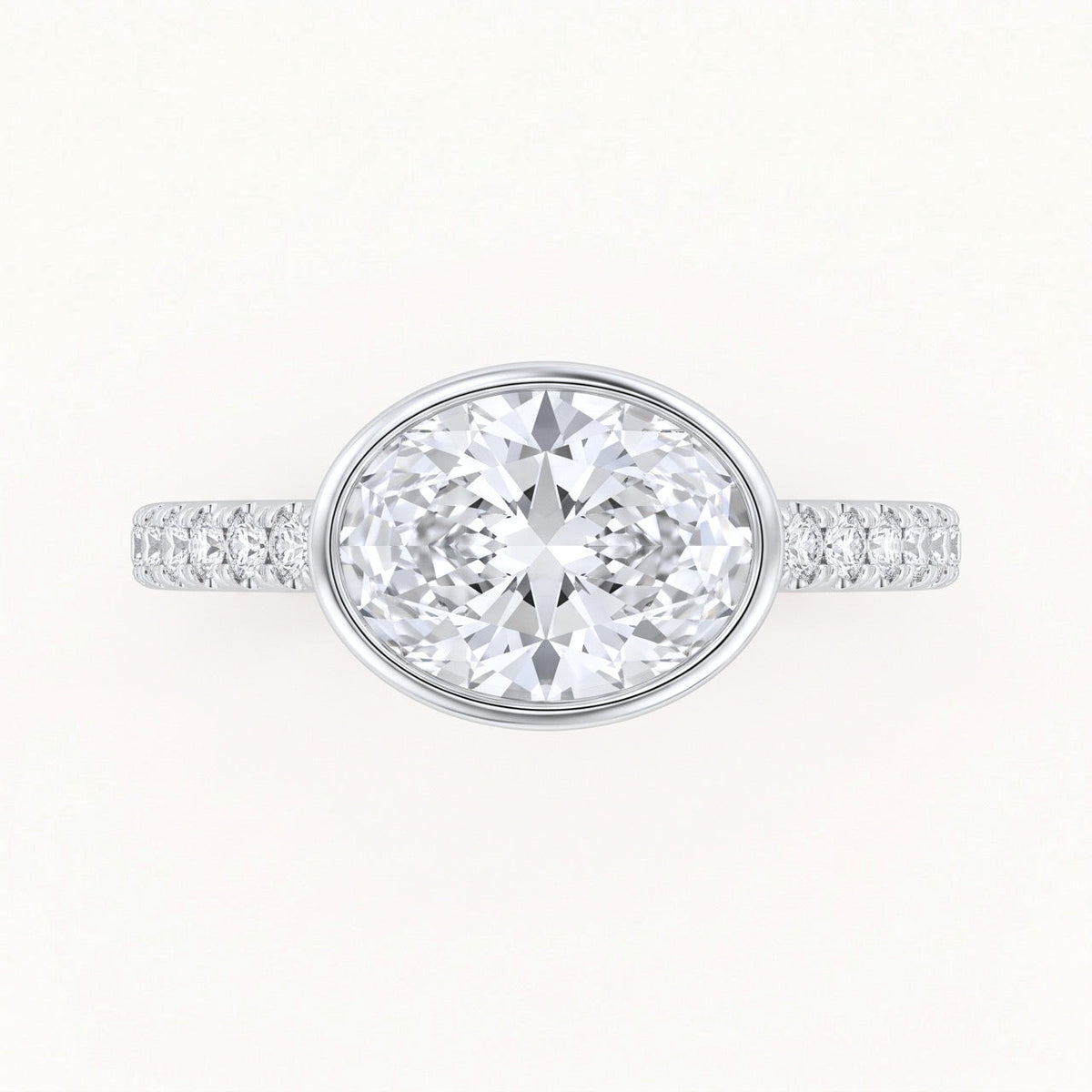 East-West Oval Bezel Engagement Ring with Pavé Band in Gold
