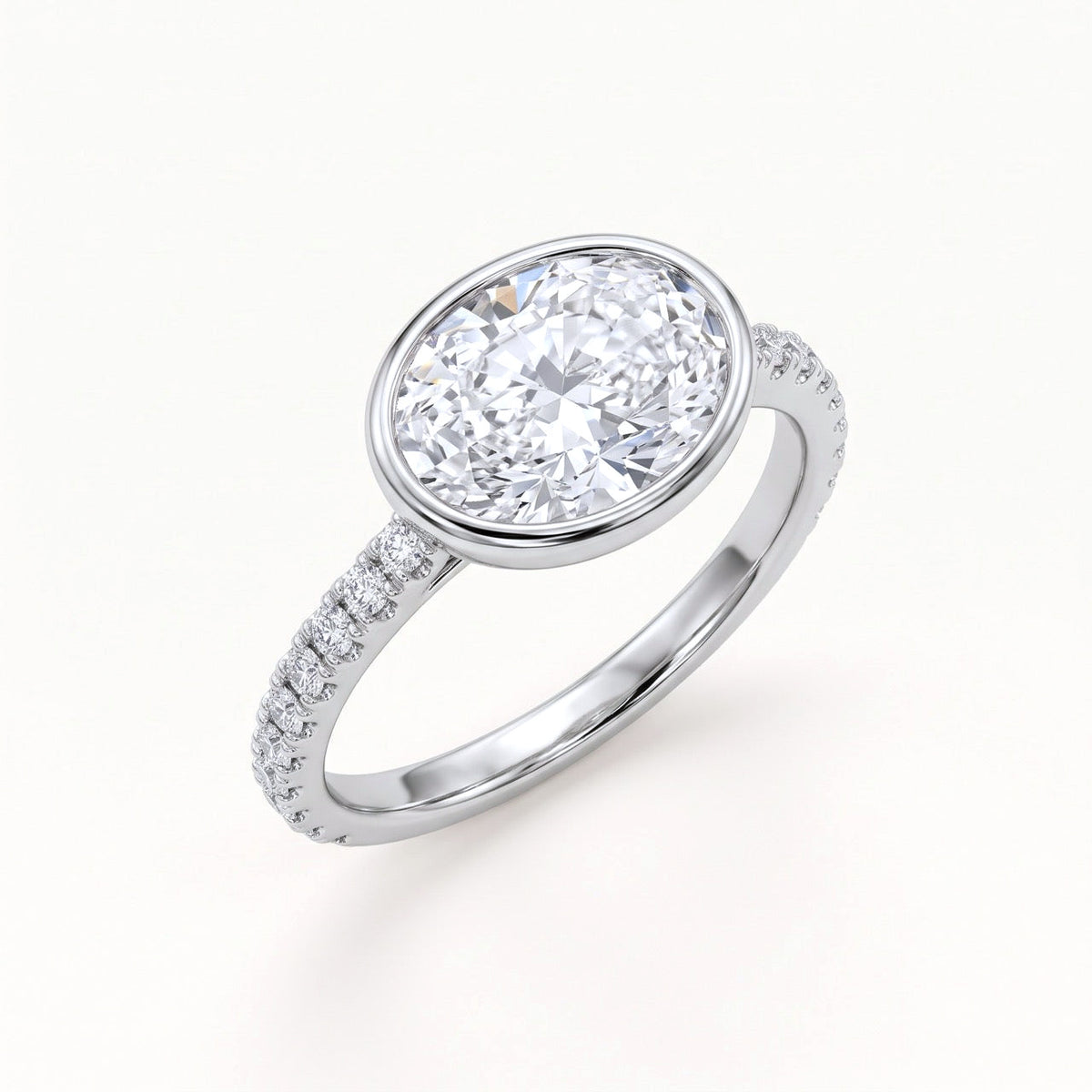 East-West Oval Bezel Engagement Ring with Pavé Band in Gold