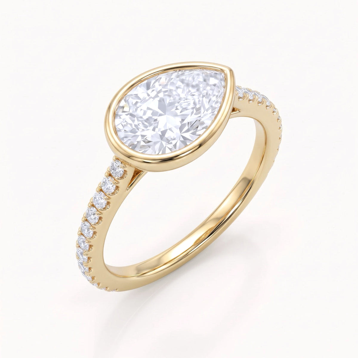 East-West Pear Diamond Bezel Engagement Ring in 14K Gold